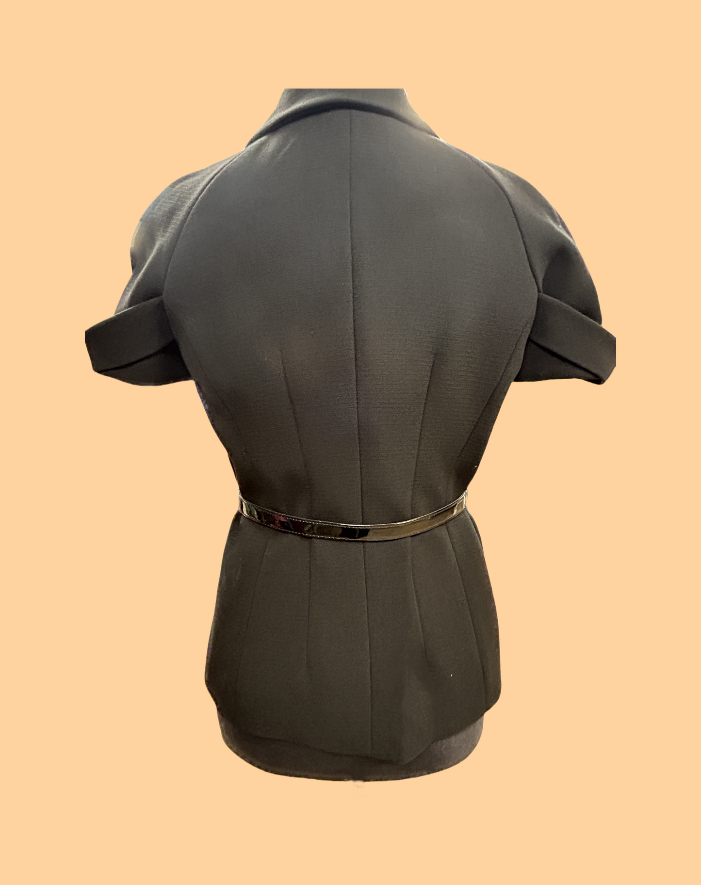 Back view of a stylish black Michael Kors blouse with short sleeves and a fitted design.