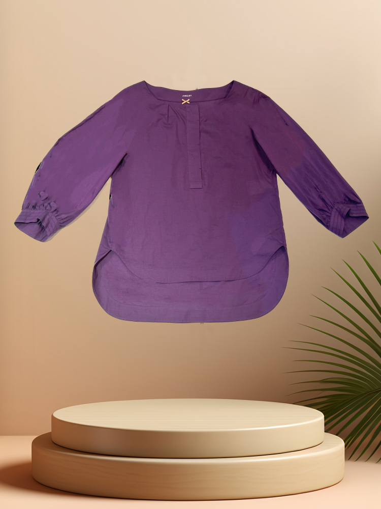 Marccain purple blouse on a display pedestal, showcasing its elegant design and high-quality fabric.
