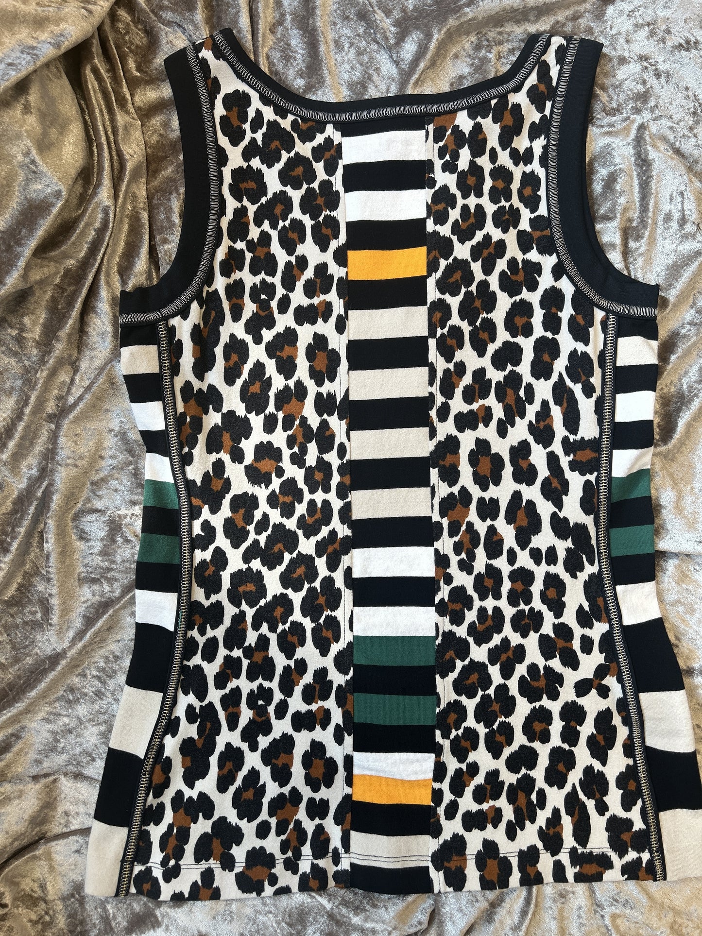 Marccain lightweight vest featuring leopard pattern and colorful stripes, perfect for summer style.