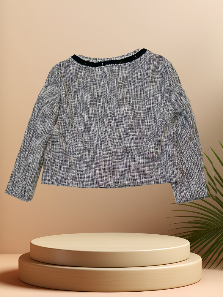 LAUREL SPRING JACKET displayed on a pedestal, showcasing its stylish design and versatile spring wardrobe essential.