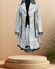 Save the Queen Black & White Stripped Coat displayed on a pedestal, perfect for spring fashion.