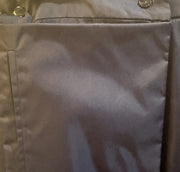 Close-up of the fabric texture and buttons on a Laurel Long Straight Skirt, highlighting its unique shine and stylish design.
