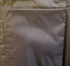 Close-up of the fabric texture and buttons on a Laurel Long Straight Skirt, highlighting its unique shine and stylish design.