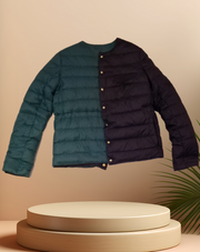 Escada Reversible Puffer jacket showcasing teal and dark purple sides, combining style and warmth with goose down filling.