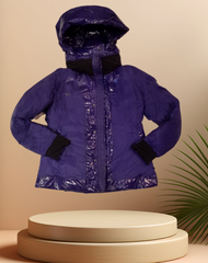 Marccain Royal Blue Reversible Quilted Jacket showcased on a display, featuring a stylish futuristic design.