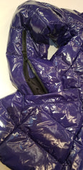 Close-up of Marccain royal blue reversible quilted jacket showing zipper details and glossy finish.