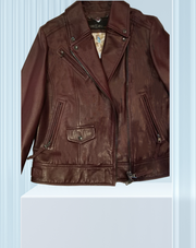 Marccain Leather Jacket in burgundy, featuring classic cut and stylish zippers, perfect for a bold fashion statement.