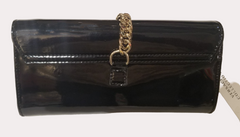 Versace Clutch in black and gold, featuring a glossy finish and elegant chain detail, perfect for any party or formal outfit.