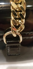Close-up of Versace Clutch featuring classic black design and elegant gold chain detail.