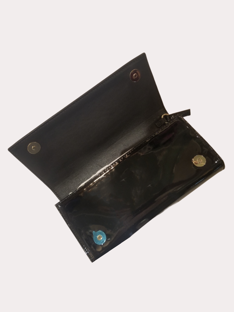 Open black leather wallet showcasing sleek interior and button closures, perfect for daily use and stylish outings.