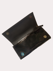 Open black leather wallet showcasing sleek interior and button closures, perfect for daily use and stylish outings.