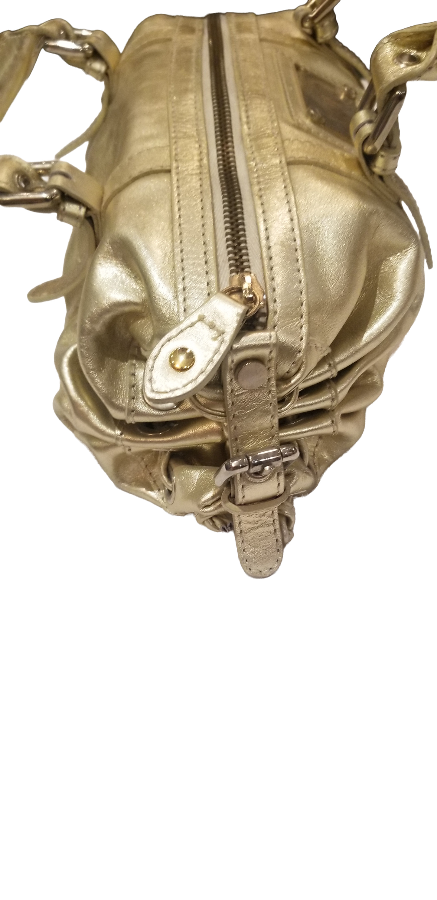 Close-up view of a luxurious Versace gold handbag featuring stylish zippers and detailing.