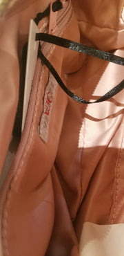 Interior view of a Versace gold handbag showcasing its elegant lining and design details, ideal for luxury fashion enthusiasts.