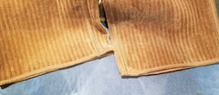 Close-up of Marccain brown corduroy straight pants showcasing the fabric texture and tailored design.