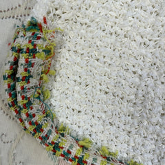 Close-up of Marccain white thread knitted skirt with colorful trim, showing breathable texture and detailed craftsmanship.