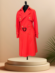 Escada Coral Long Coat displayed on a mannequin, featuring a classic cut and elegant design in a vibrant coral color.