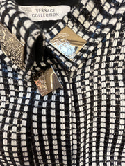 Close-up of Versace Black & White Checked Jacket showcasing detailed fabric and logo.
