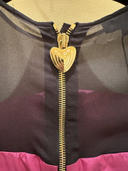 Close-up of the heart-shaped zipper detail on an Escada purple silk dress with black tulle accents.
