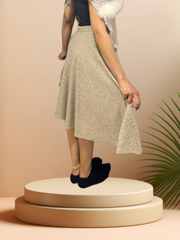 Model showcasing the Seventy Circular Skirt in wool, highlighting its comfort and classic design on a display platform.