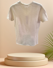 Marccain creamy blouse made from wool, perfect for winter and early spring fashion, displayed on a round pedestal.