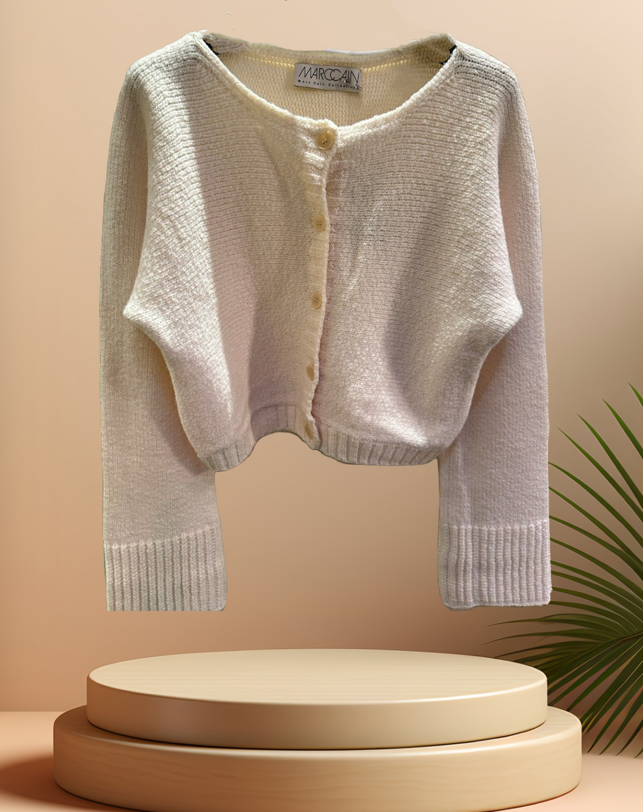 Marccain creamy cardigan in lightweight merino wool blend, featuring a short-waisted design and button closure.