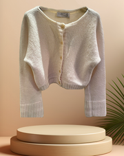 Marccain creamy cardigan in lightweight merino wool blend, featuring a short-waisted design and button closure.