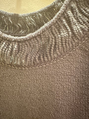 Close-up of the thread neckline detail on a Marccain Sweater in gray, showcasing premium fabric and craftsmanship.