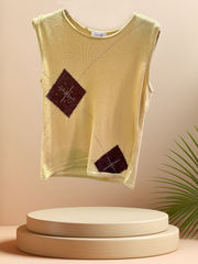 Laurel Vest in soft yellow fabric featuring brown geometric designs, perfect for stylish everyday wear.