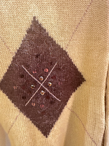 Close-up of Laurel Vest featuring brown diamond pattern with embellishments, highlighting craftsmanship and style.