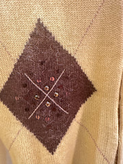 Close-up of Laurel Vest featuring brown diamond pattern with embellishments, highlighting craftsmanship and style.