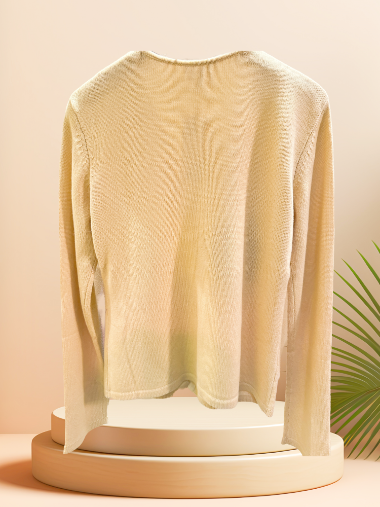 Back view of a soft, elegant light cardigan made from silk and cashmere, showcasing its timeless design.