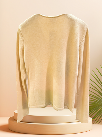 Back view of a soft, elegant light cardigan made from silk and cashmere, showcasing its timeless design.