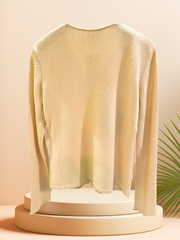 Back view of a soft, elegant light cardigan made from silk and cashmere, showcasing its timeless design.