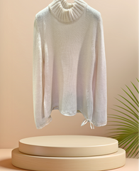 Laurel Sweater in creamy white, stylish and warm, featuring a turtleneck and fine material, perfect for cold weather.
