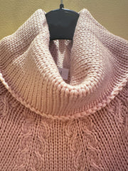 Close-up of a cozy peach puff Laurel Sweater with a chunky cowl neck, showcasing its 100% new wool texture.