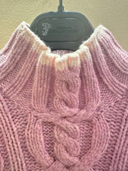 Close-up of a cozy pink Escada sweater showcasing braided detail and a thick collar, ideal for stylish warmth.