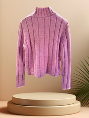 Escada pink sweater with ribbed texture displayed on a pedestal, featuring a cozy turtleneck design.