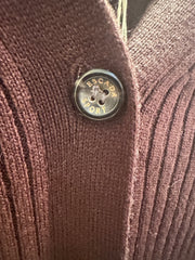 Close-up of Escada brown cardigan featuring a stylish button, showcasing its classic design and premium material.