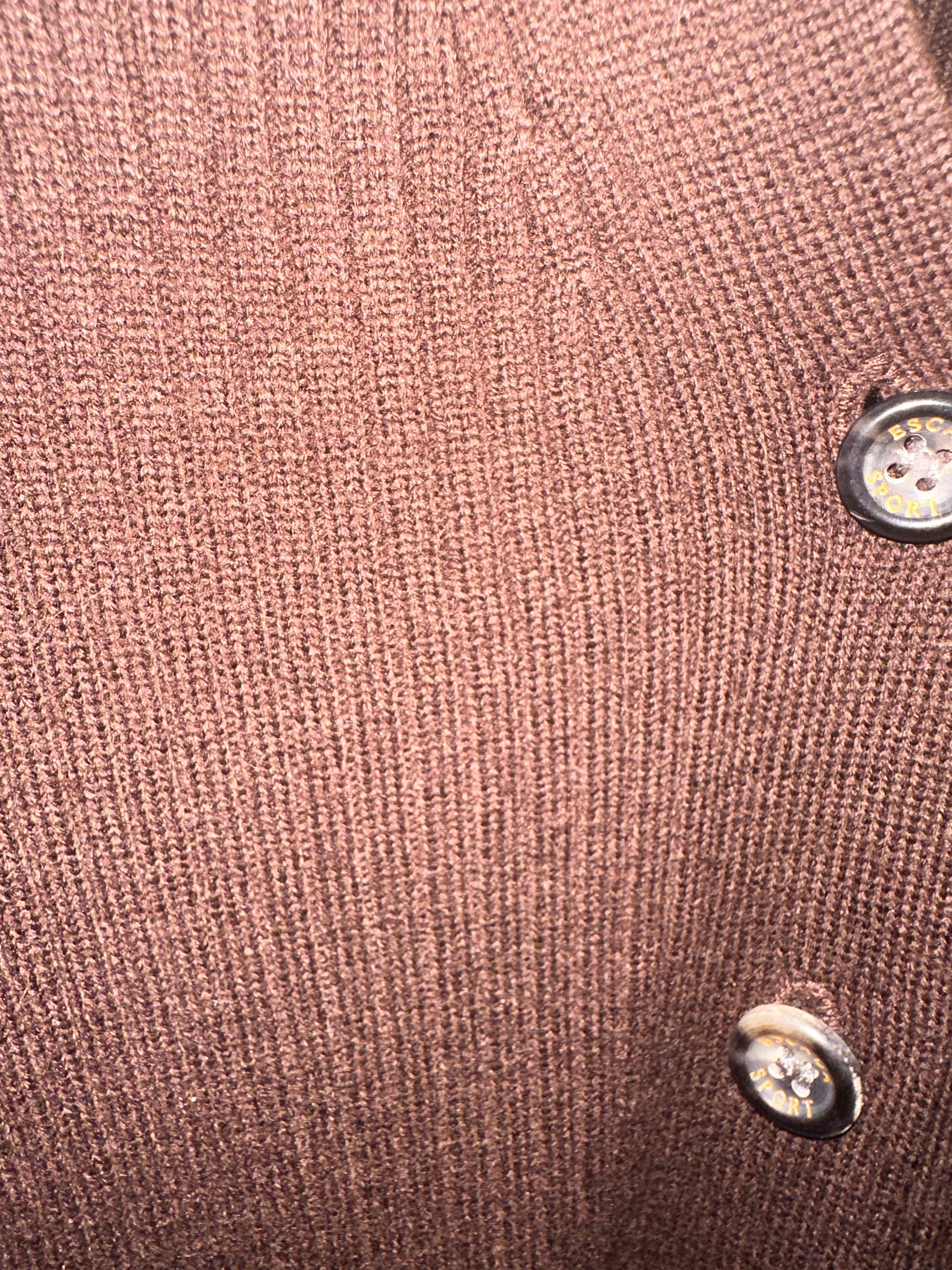 Close-up detail of Escada brown cardigan fabric with buttons, showcasing its classic cut and soft texture.