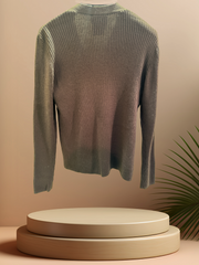 Escada brown cardigan displayed on a stand, showcasing its classic cut and ribbed texture, perfect for fall and winter layering.