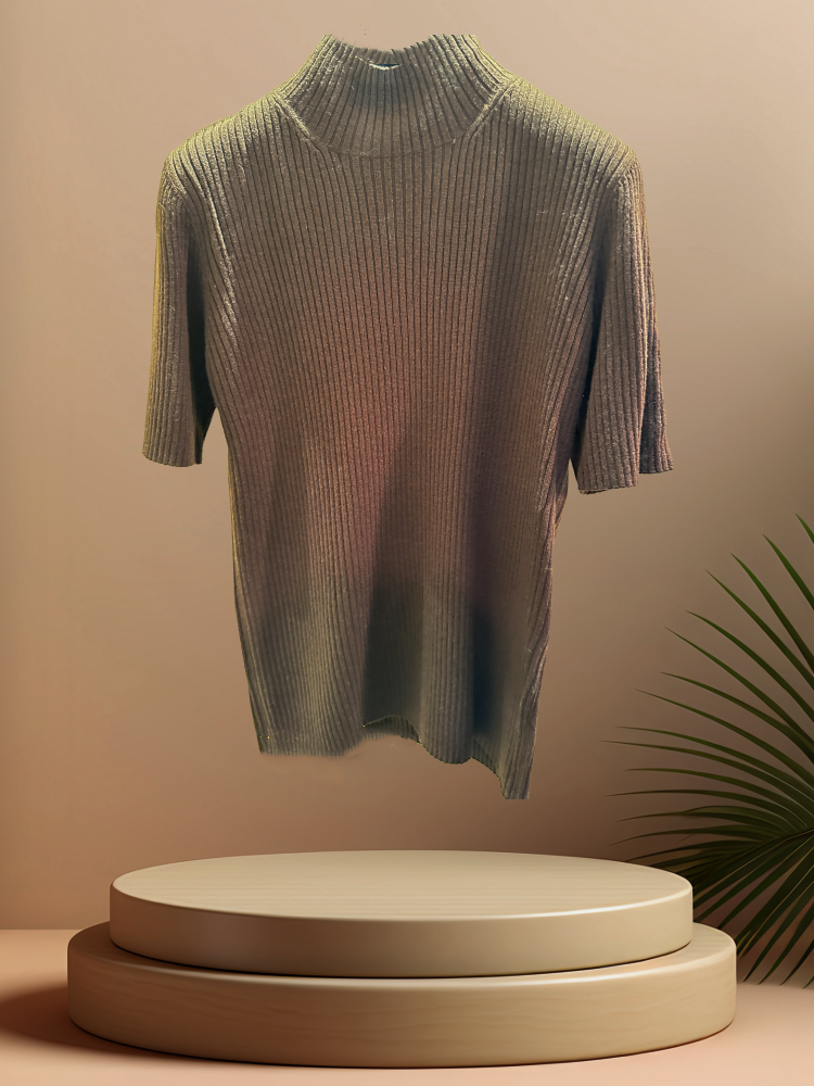 Lightweight ribbed blouse displayed on a pedestal with a minimalist backdrop, perfect for casual or office wear.