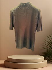 Lightweight ribbed blouse displayed on a pedestal with a minimalist backdrop, perfect for casual or office wear.