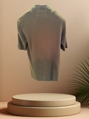 Escada blouse made from 90% new wool and 10% cashmere, showcased on a display platform with a subtle background.