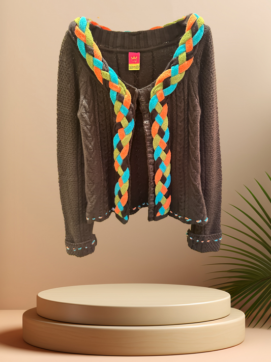 Save the Queen Cardigan featuring a colorful braided line, adding style to any outfit. Made of 50% Wool and 50% Acrylic.