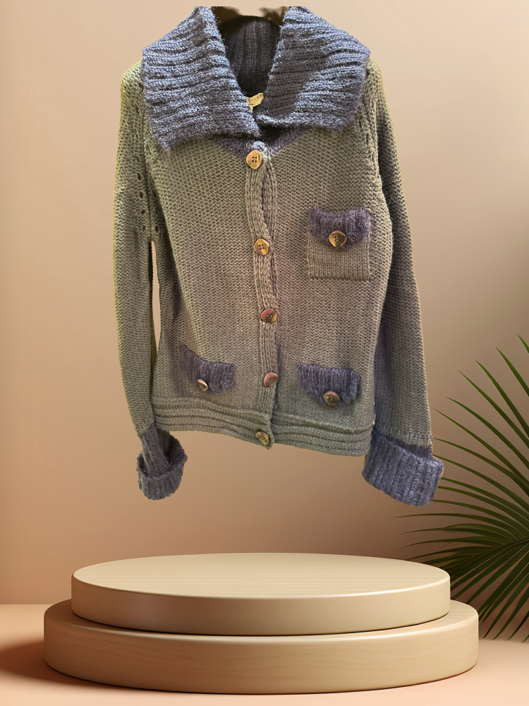 Essentiel Cardigan Sweater in lamb wool with large lapel and pockets, showcasing classic style with a modern twist.