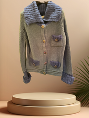 Essentiel Cardigan Sweater in lamb wool with large lapel and pockets, showcasing classic style with a modern twist.
