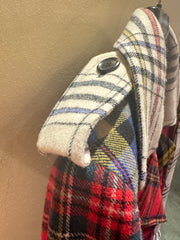 Close-up of Moschino long tartan coat showcasing its stylish collar and vibrant plaid fabric.