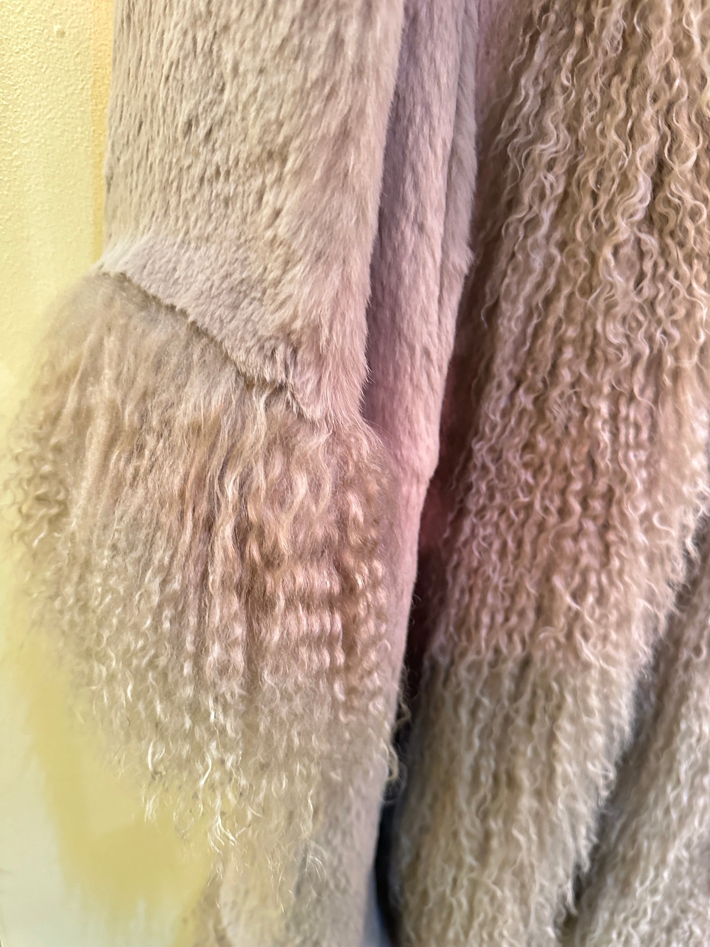 Close-up of the soft texture of the Essential Long Fur Coat, made from 100% rabbit fur in a luxurious design.