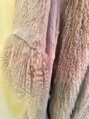 Close-up of the soft texture of the Essential Long Fur Coat, made from 100% rabbit fur in a luxurious design.