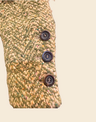 Close-up of Marccain Long Coat sleeve showcasing textured green fabric and black buttons, highlighting vintage style.
